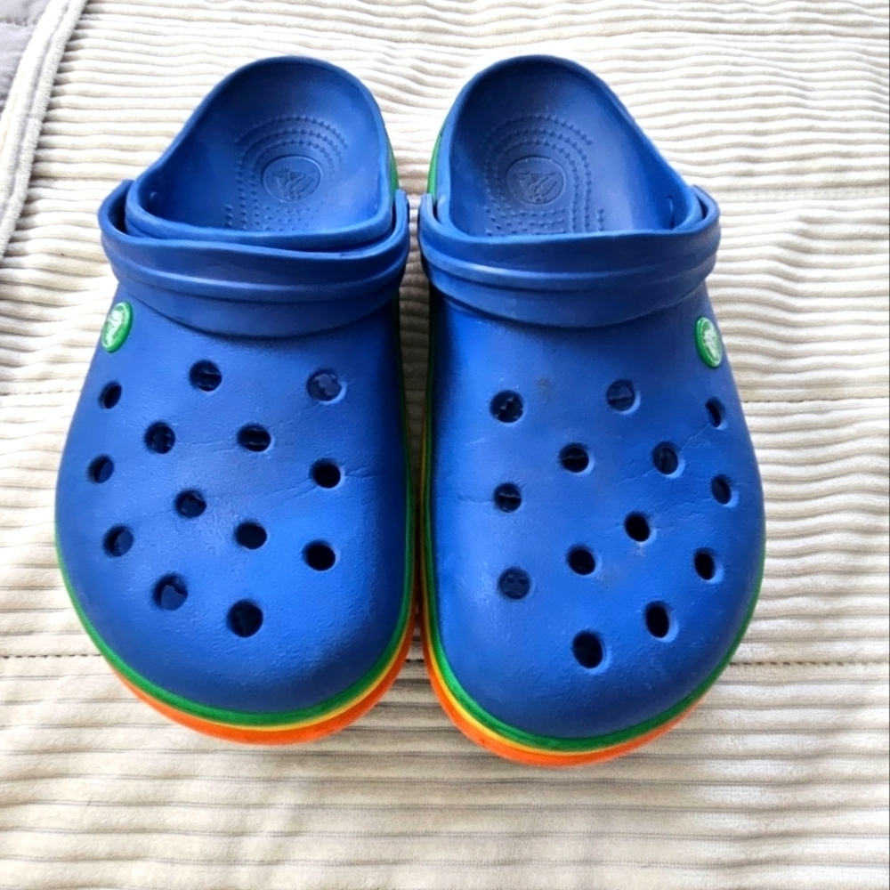 Crocs womens Blue w rainbow stripe bottom.  Size 9 W 7M